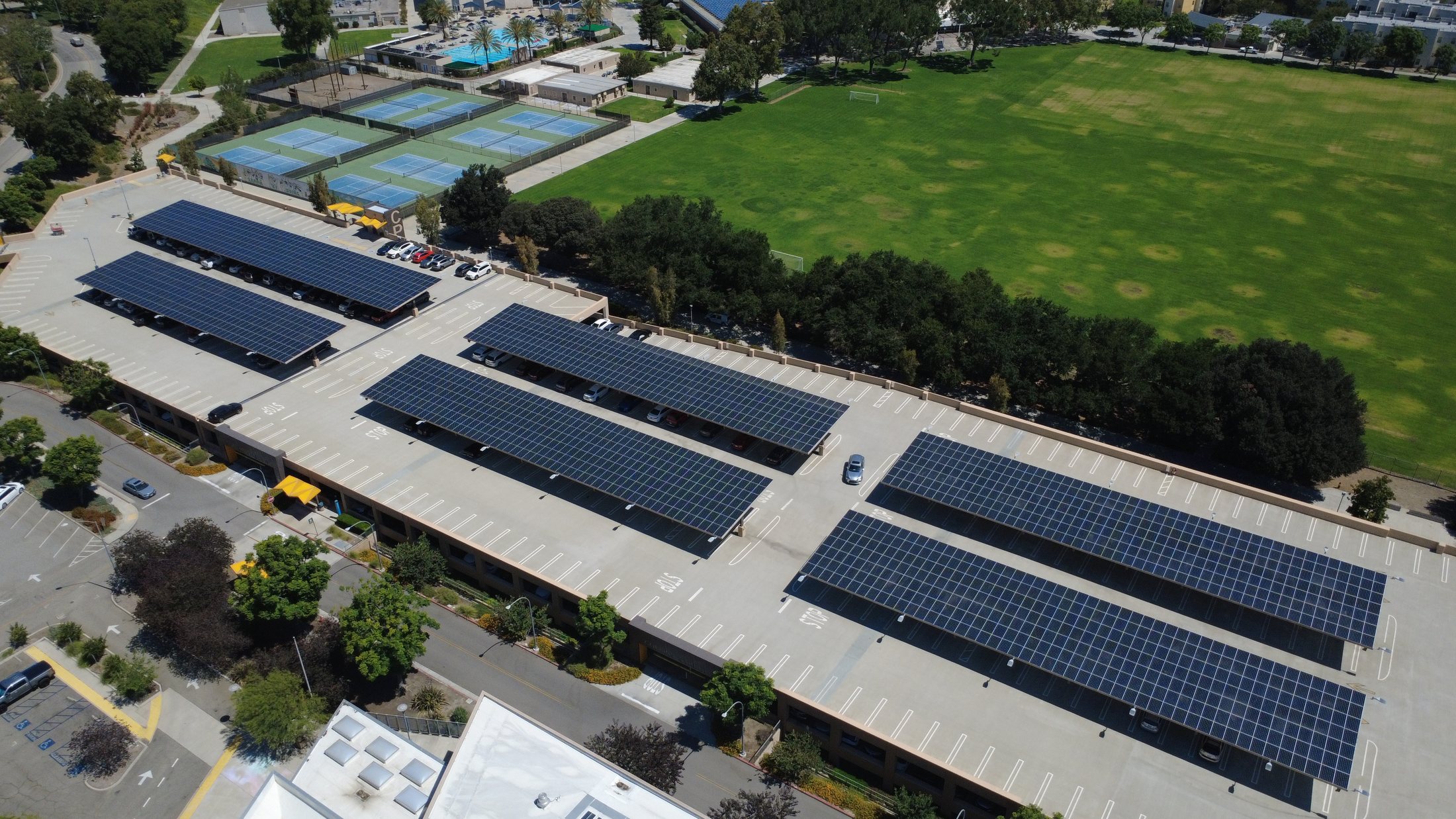 Aerial view of completed solar carport installation on a university campus